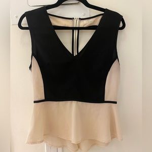 Péplum top with beautiful cut out detail in back